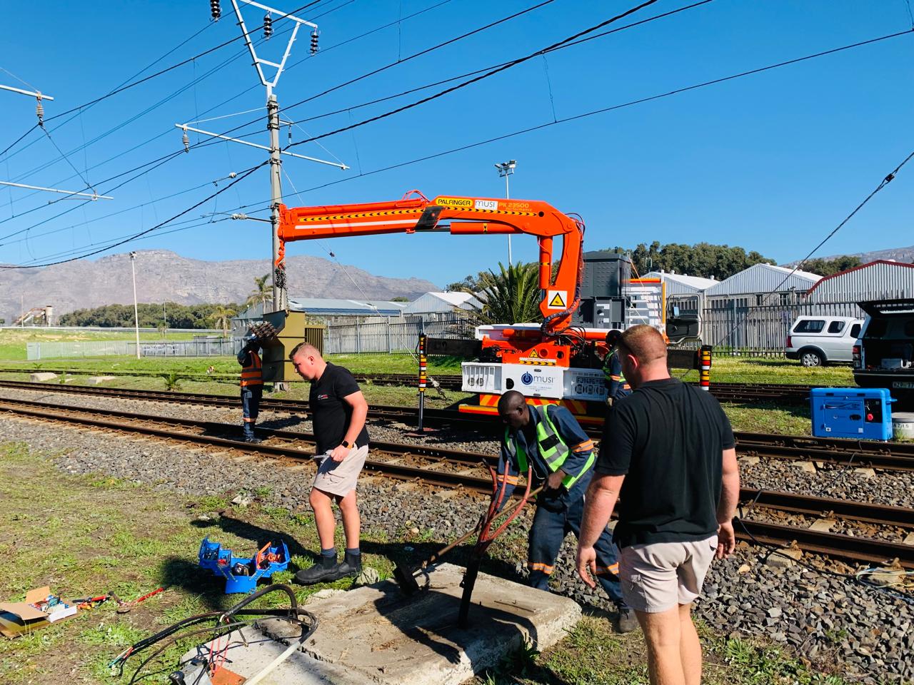 Palfinger crane on rail line